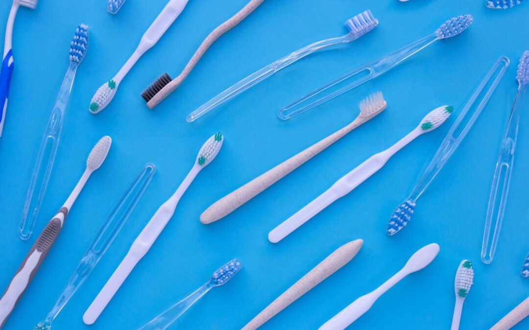 Toothbrushes on blue background. Dental care concept